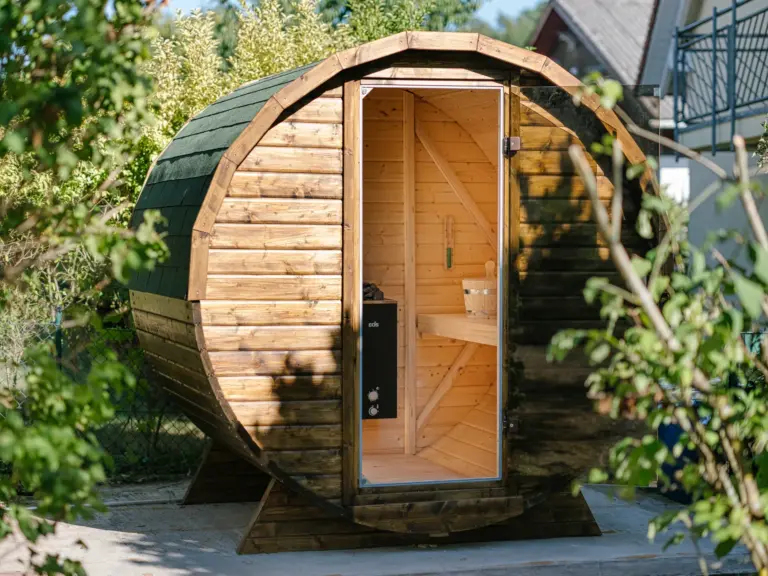 Finnish sauna at the Stay Eden MOONSTONE apartment in Ramstein, featuring a classic wooden interior for a relaxing wellness experience.