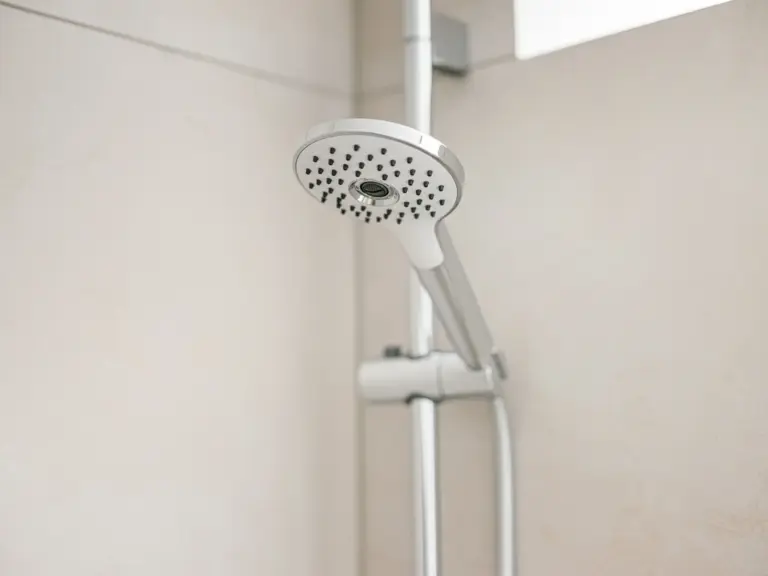 Modern shower head in OPAL GREEN apartment bathroom