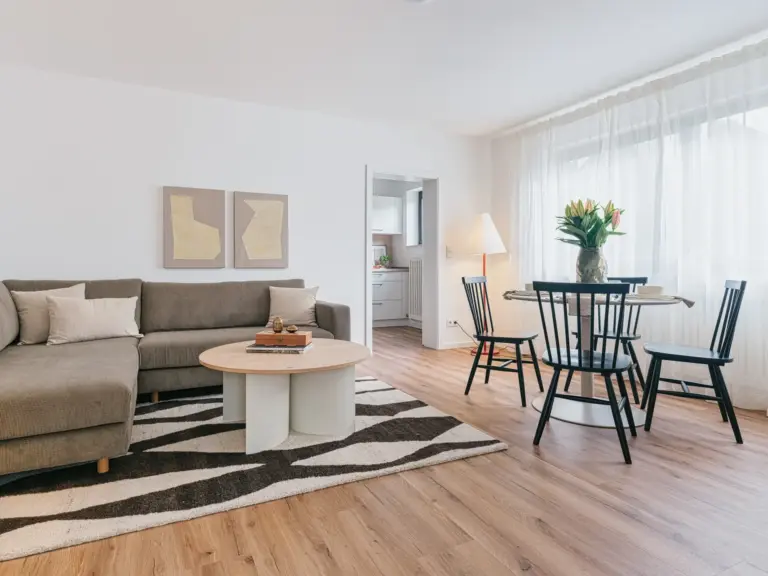 Open living and dining area in OPAL GREEN TLA apartment near Ramstein Air Base