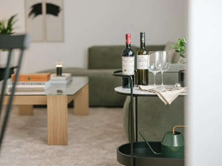 Bar cart with wine and glasses in OPAL BLUE TDY and TLA apartment