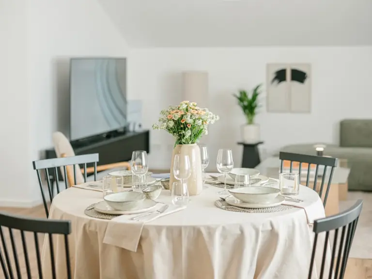 Dining table set for four in OPAL BLUE TDY and TLA apartment