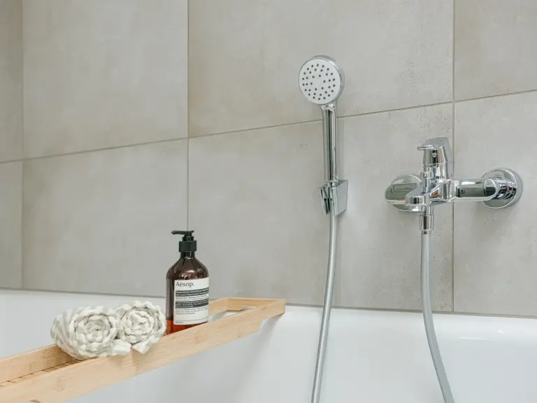 Bathtub with handheld shower and bath tray in OPAL BLUE main bathroom