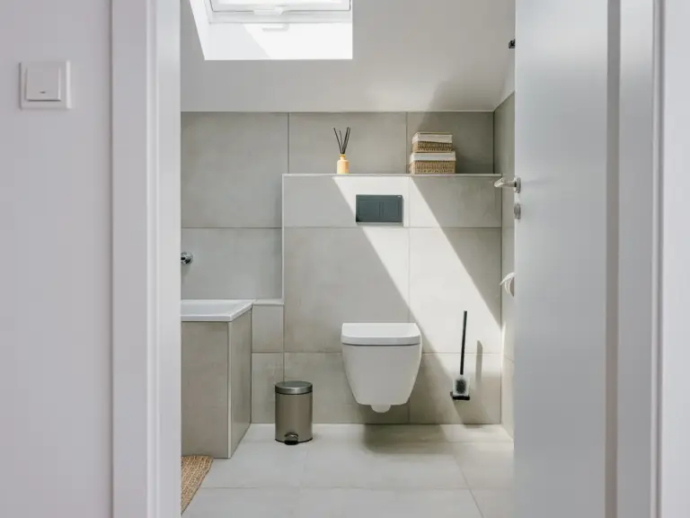 Modern main bathroom with walk-in shower and wall-mounted toilet in OPAL BLUE