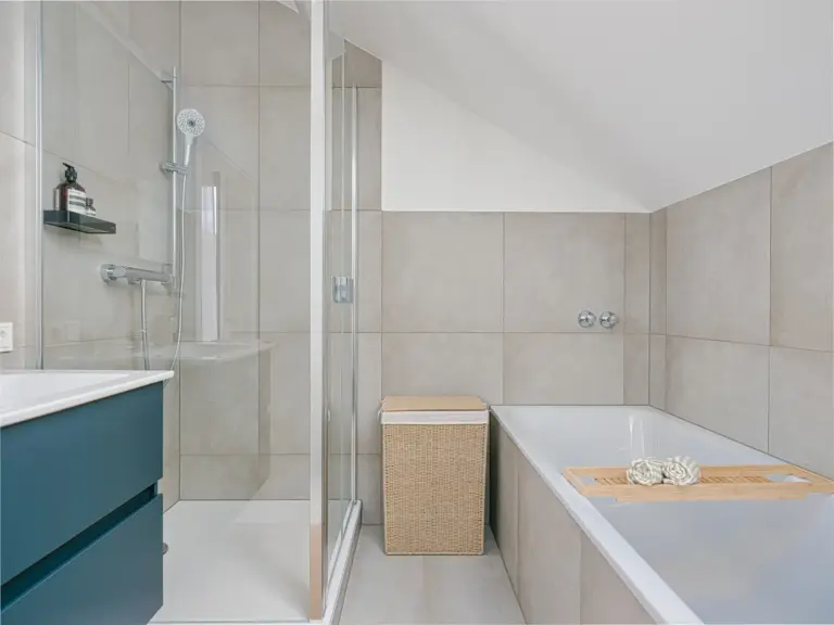 Main bathroom with walk-in shower and bathtub in OPAL BLUE