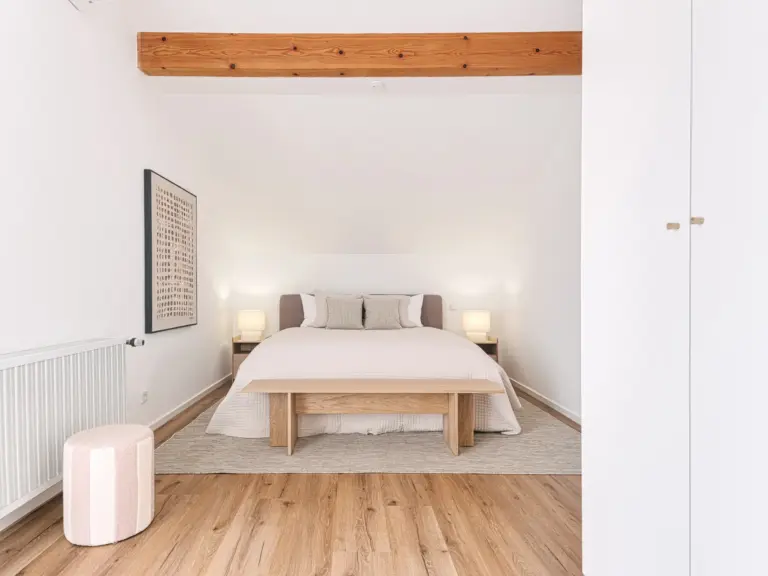 Master bedroom with king-size bed in OPAL BLUE TLA apartment near Ramstein Air Base