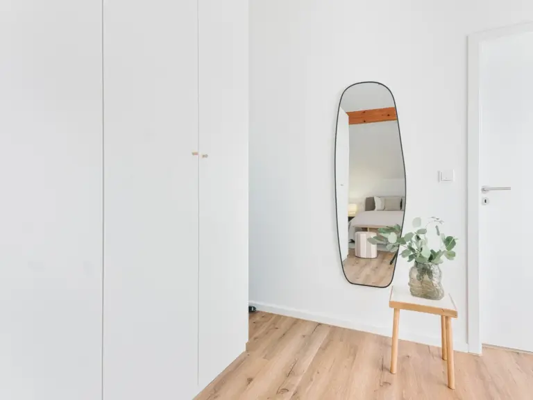 Full-length mirror and wardrobe area in OPAL BLUE master bedroom