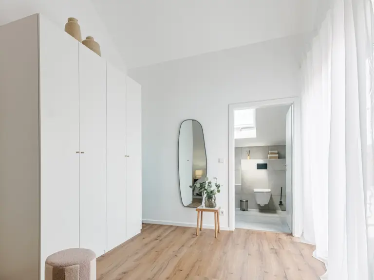 Wardrobe, full-length mirror and en-suite bathroom access in OPAL BLUE master bedroom