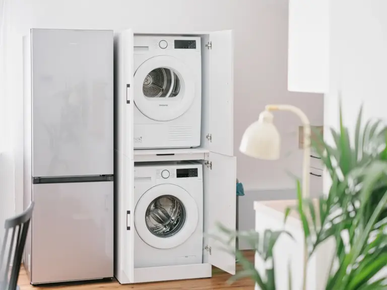 Stacked washer and dryer unit in OPAL BLUE TLA apartment near Ramstein Air Base