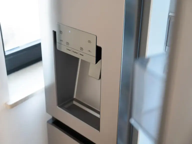 Modern side-by-side fridge with built-in water and ice dispenser