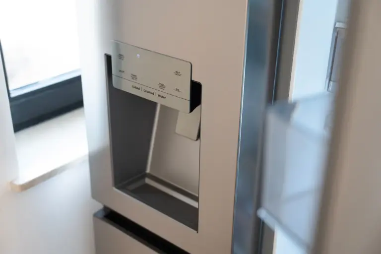 Modern side-by-side fridge with built-in water and ice dispenser