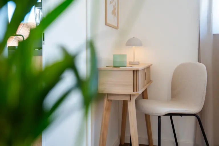 Dedicated workspace with desk, chair and lamp in bright bedroom corner of Opal White