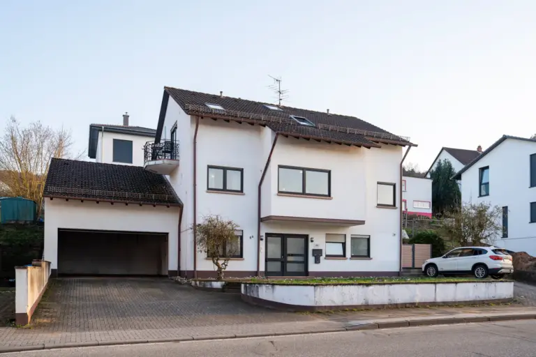 Stay Eden Opal apartments building with driveway, garage and parking