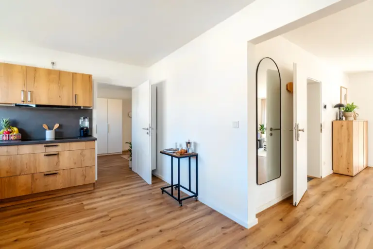 Hallway and kitchen transition area in Opal White apartment
