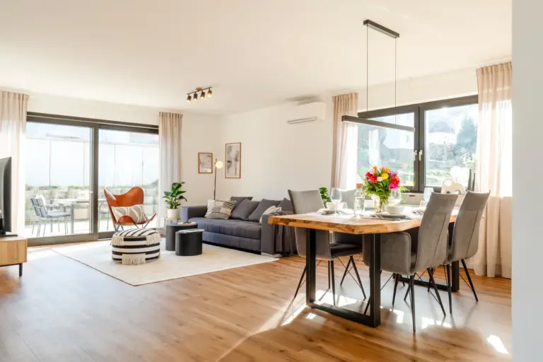 Spacious open living and dining area with terrace access in Opal White apartment