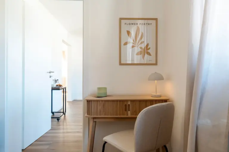 Dedicated workspace desk with chair and soft lighting in Opal White apartment