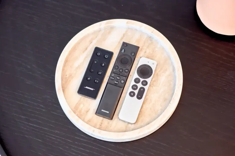 Remote controls for the entertainment system at CORAL BLOOM arranged on a decorative tray