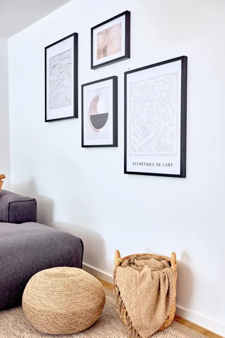 Curated wall art and natural decorative details in the CORAL BLOOM living room