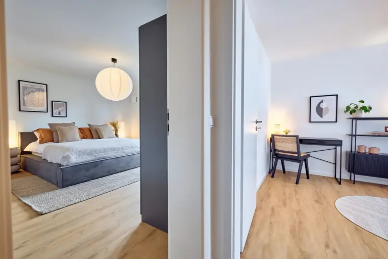 CORAL BLOOM view of the spacious bedroom and separate home office with desk