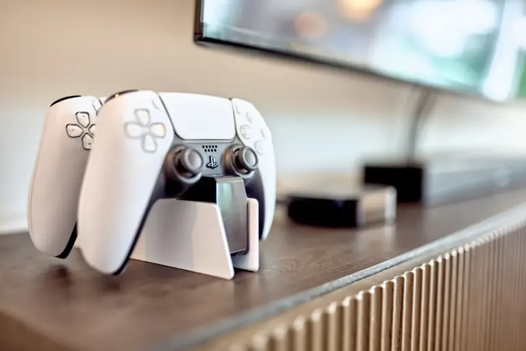 PlayStation 5 DualSense controllers and entertainment setup at CORAL BLOOM
