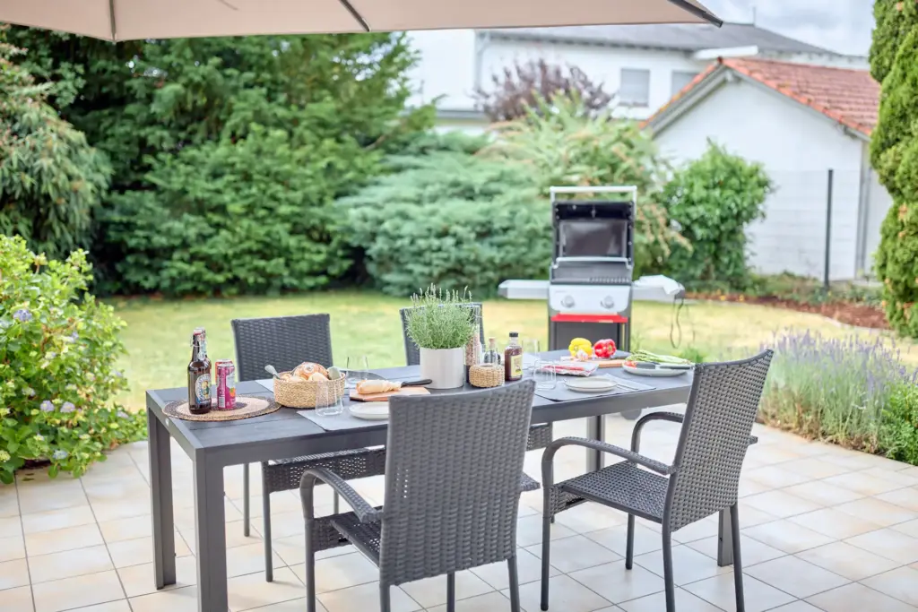 Private terrace with outdoor dining area, garden and gas grill at CORAL BLOOM