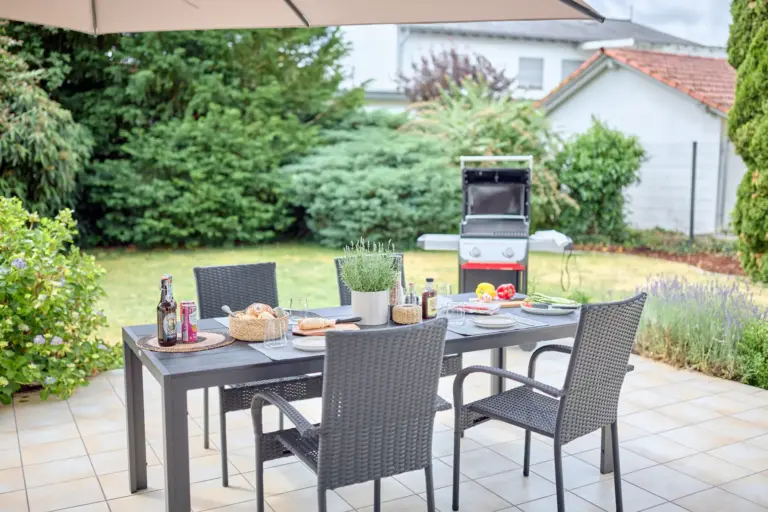 Private terrace with outdoor dining area, garden and gas grill at CORAL BLOOM