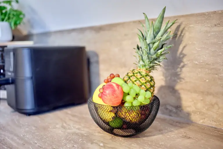 Fresh fruit basket on the kitchen countertop at CORAL SUN