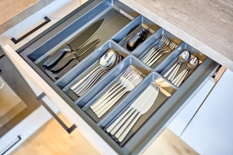 Organized cutlery and kitchen knives in a drawer at CORAL SUN