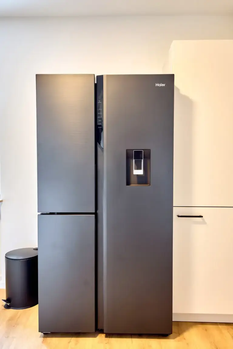 Large Haier side-by-side refrigerator with integrated water dispenser in the CORAL SUN kitchen