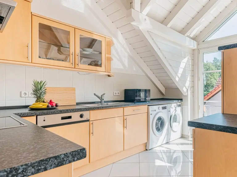 Spacious fully equipped kitchen with washer and dryer at EMERALD GROVE