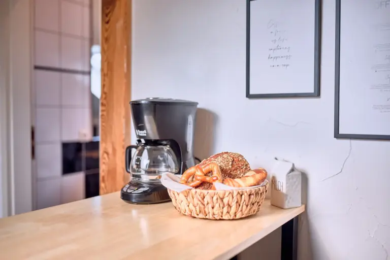 Coffee station with coffee maker and breakfast basket at Stay Eden AMBER GLOW
