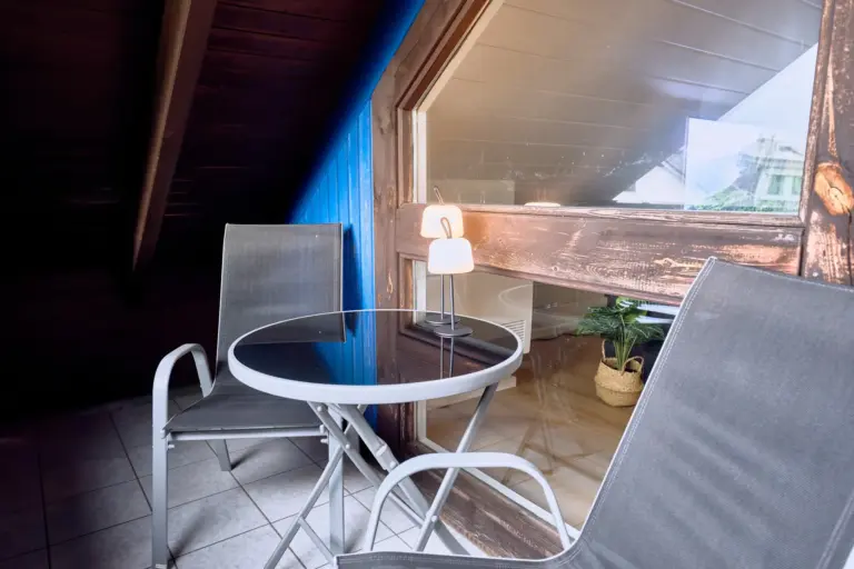 Private balcony seating area at Stay Eden AMBER GLOW