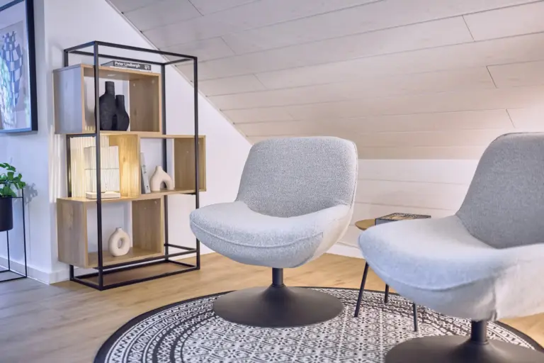 Cozy seating area with modern armchairs at Stay Eden AMBER GLOW