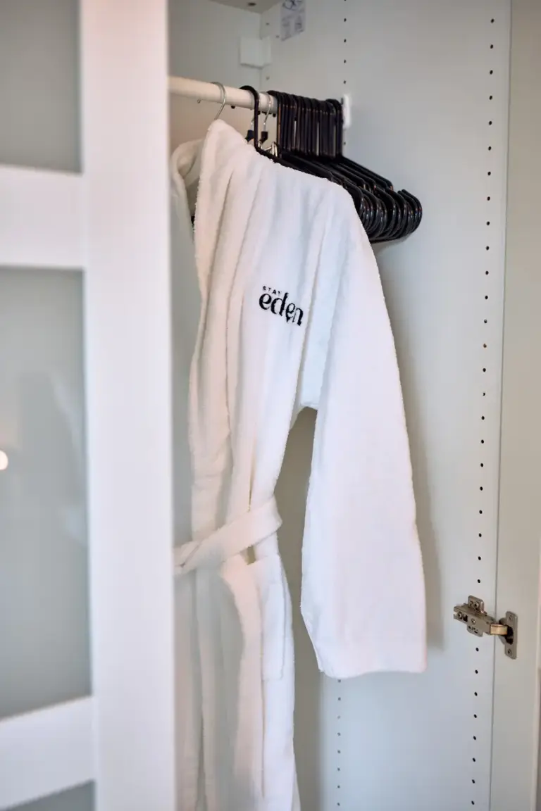 Bathrobe and wardrobe in king-size bedroom at Stay Eden AMBER GLOW
