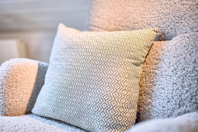 Decorative pillows on reading chair at Stay Eden AMBER GLOW