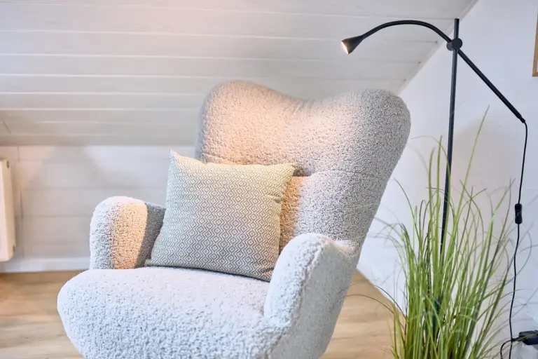 Comfortable reading chair in king-size bedroom at Stay Eden AMBER GLOW