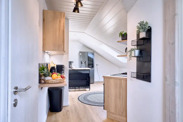 Fully equipped kitchen with side-by-side fridge at Stay Eden AMBER GLOW