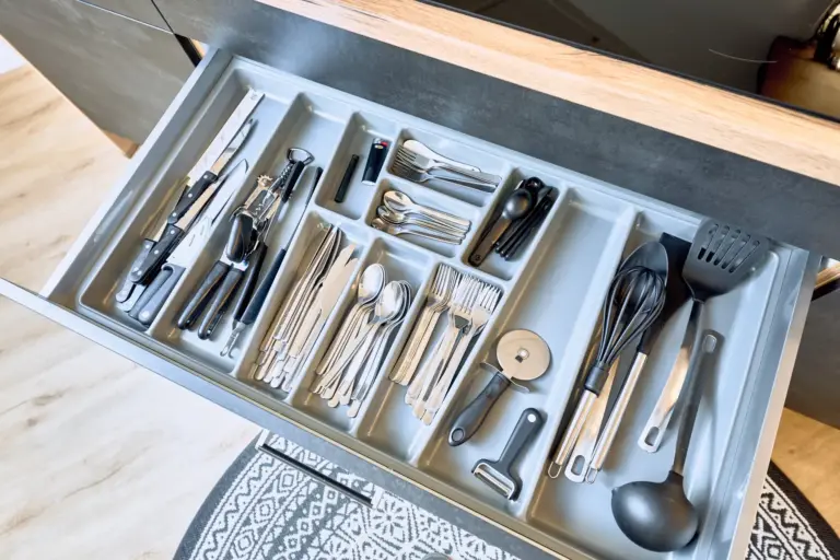 Cutlery and cooking utensils in fully equipped kitchen at Stay Eden AMBER GLOW