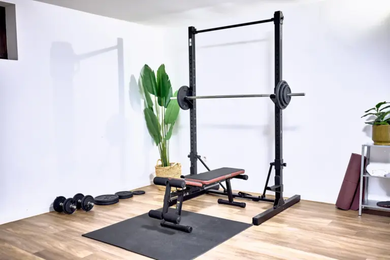 Weight bench and barbell station at AMBER GOLD and AMBER GLOW home gym