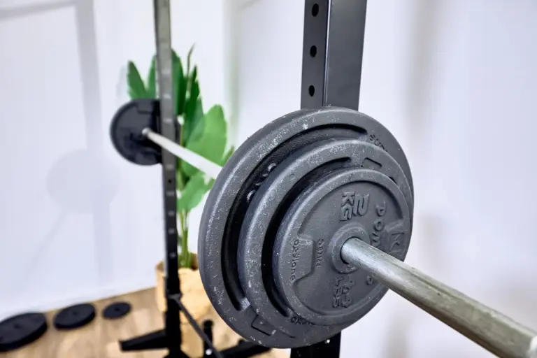 Barbell and weight plates in the home gym at AMBER GOLD and AMBER GLOW