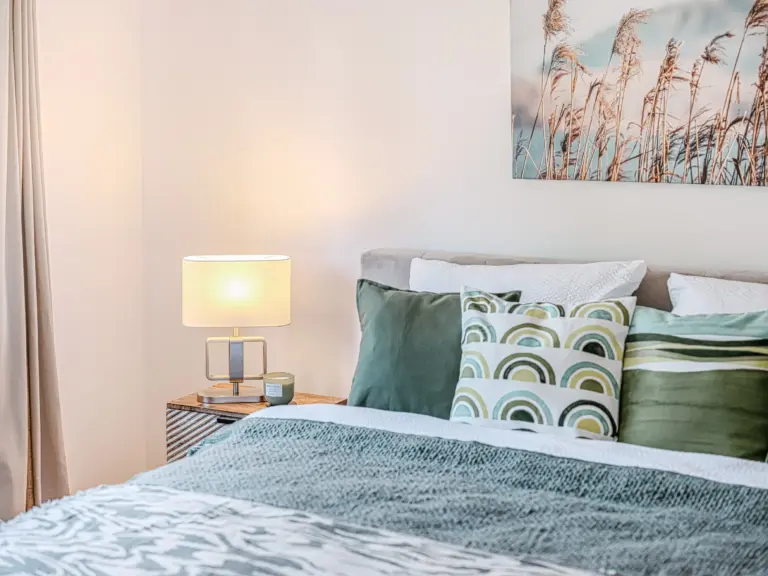 Comfortable king-size bed in the master bedroom at PEARL WHITE