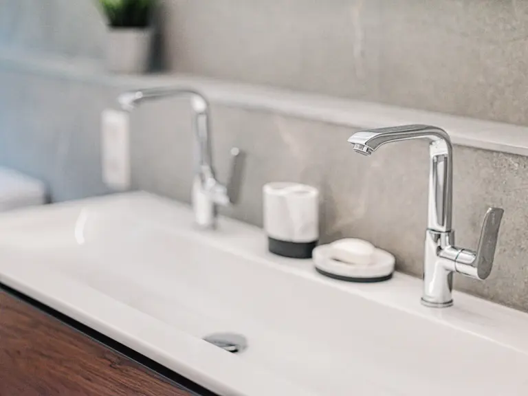 Modern bathroom sink and chrome faucet at RUBY RED