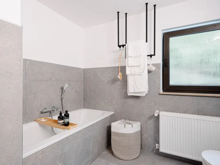 Bathroom with bathtub and separate shower at RUBY RED