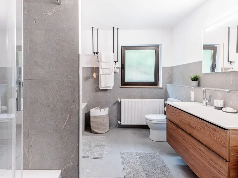 Modern bathroom with bathtub and shower at RUBY RED