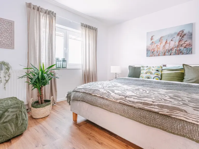 Bright master bedroom with king-size bed at PEARL WHITE