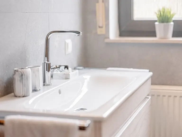 Bathroom sink with toiletries and modern fixtures at RUBY NOIR