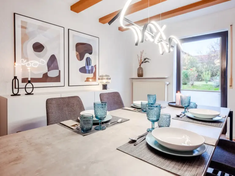 Set dining table with modern chairs at RUBY RED