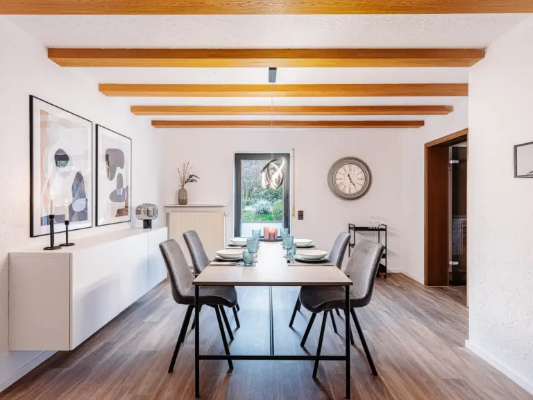 Spacious dining room with dining table and six chairs at RUBY RED