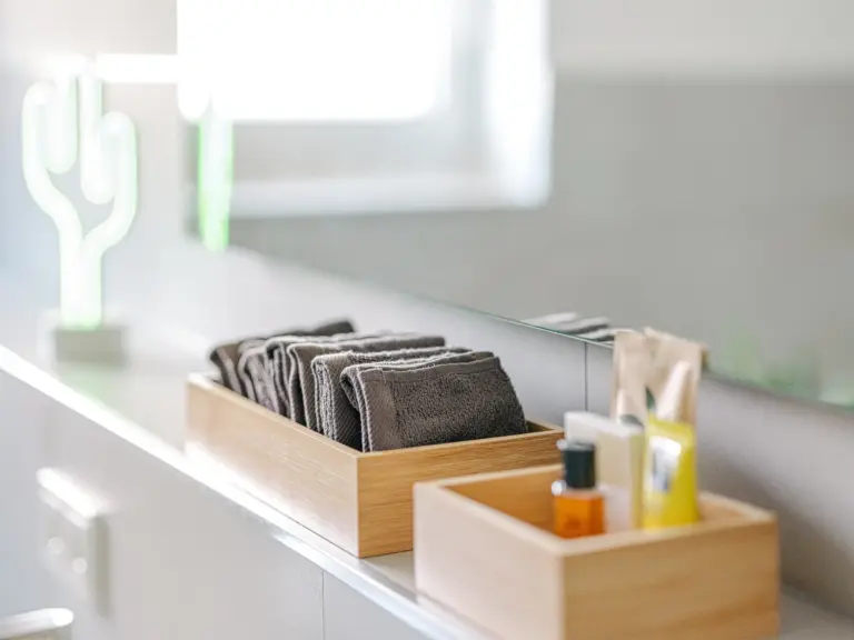 Towels and bathroom amenities provided at PEARL WHITE