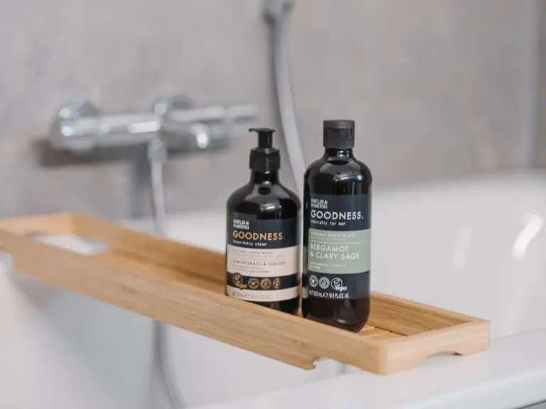 Bathtub with guest amenities at RUBY RED