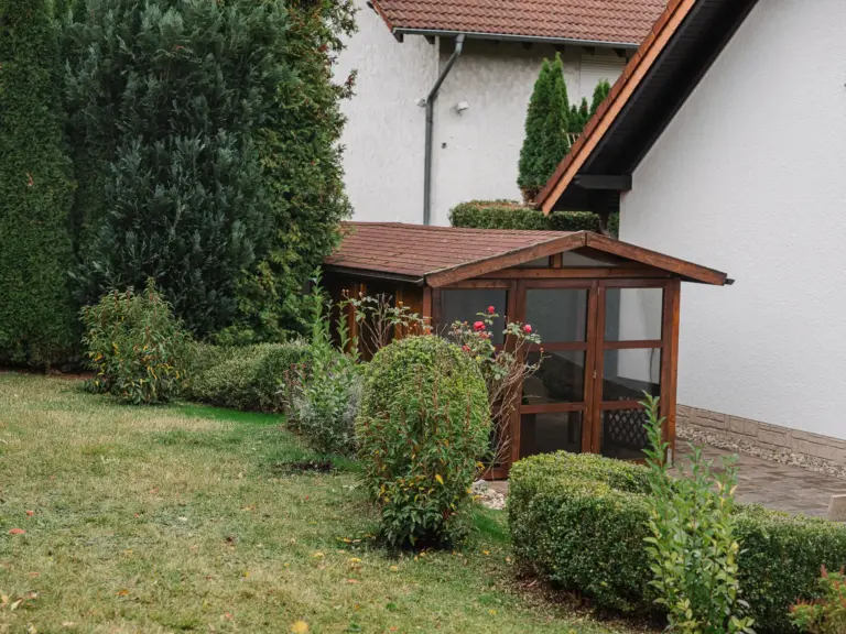 Private covered terrace surrounded by garden at RUBY RED